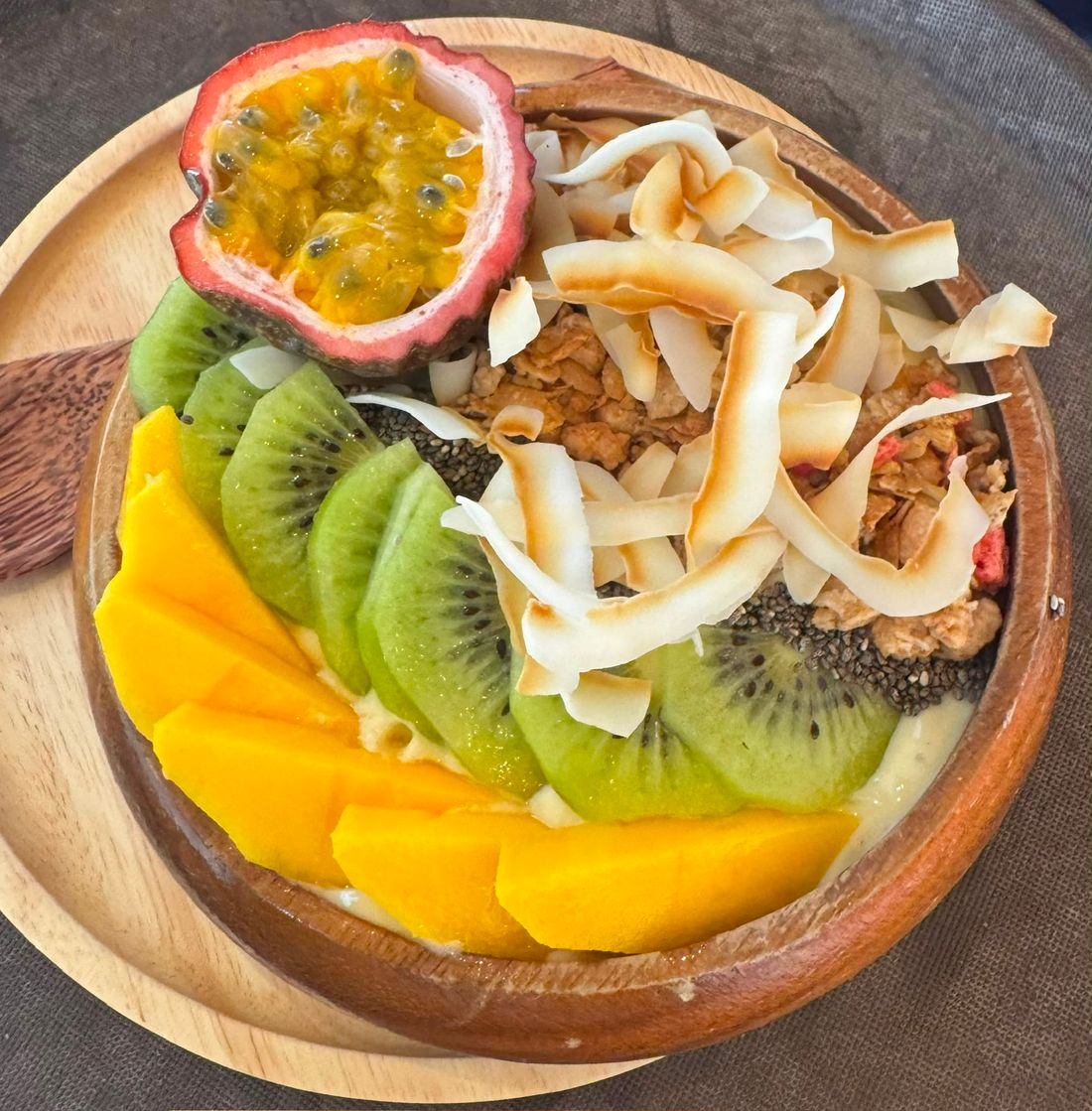 Fruit bowl with mango, kiwi and coconut
